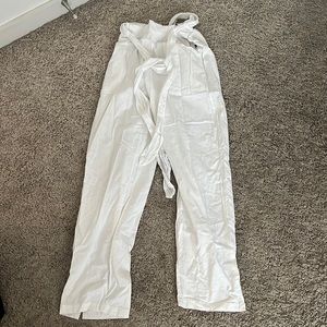 White linen pants with a tie around the waist